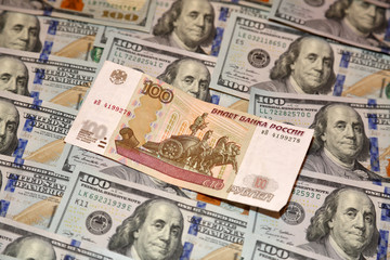 Parer american dollars and russian rubles bills 
