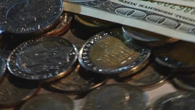 Money of different countries are circling around a close-up loop