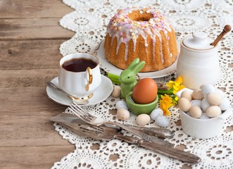 Sliced easter orthodox sweet bread, kulich with white tulips. Breakfast. 