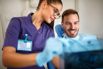 Dentist working with patient in dental ordination