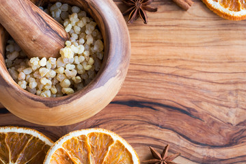 Frankincense resin in a mortar with copy space