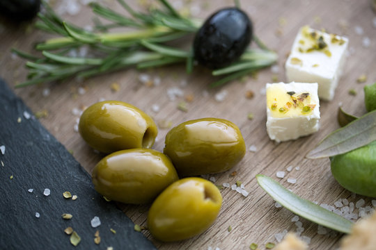 green olives and feta cheese with olive oil.