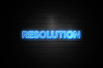 Resolution neon Sign on brickwall