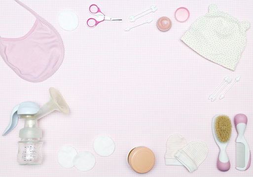Newborn items on the pink background, knolling style. Top view. Flat lay.