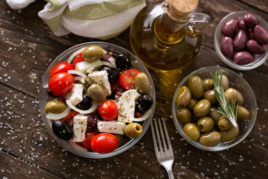 Greek salad with fresh vegetables, feta cheese and green olives.
