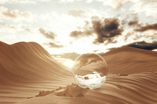 Glaskugel in der Wüste im Sonnenuntergang. 3D Rendering