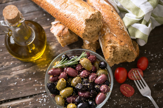 Mediterranean olives for salad in oil vegetarian food top view.