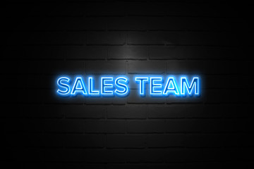 Sales Team neon Sign on brickwall