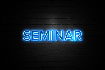 Seminar neon Sign on brickwall