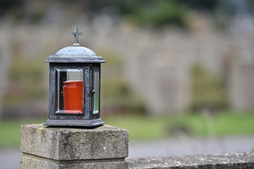 Fototapeta na wymiar Tomb lamp on a cemetery in Muenster-Germany