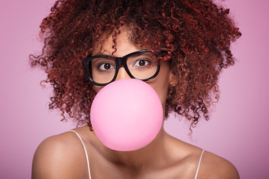 Afro Girl Blowing Bubble Gum Balloon.