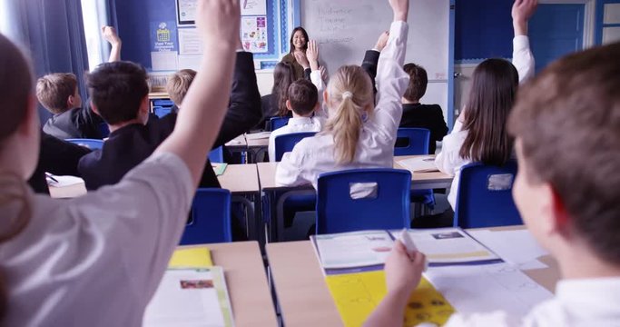 4k, Students in a classroom raising hands together