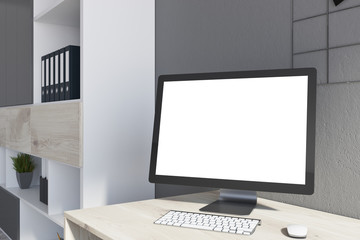 White desktop screen on office desk