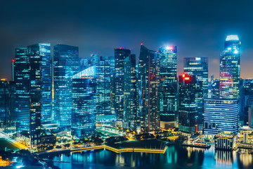 Singapore city skyline. Business district aerial view. Downtown landscape reflected in water at night in Marina Bay. Travel cityscape - obrazy, fototapety, plakaty
