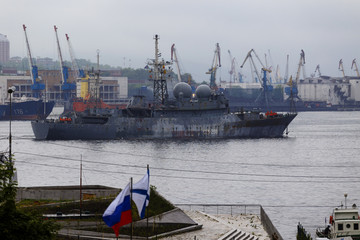 Vladivostok, Russia, 2017: Merchant and warships on the roadstead in the Golden Horn Bay in...