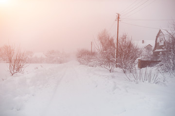 Winter snowfall in the village. Snowy collapse