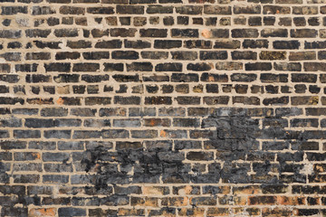Black Weathered Brick Wall