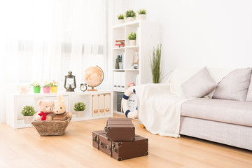 kid playroom with toy and vintage suitcase