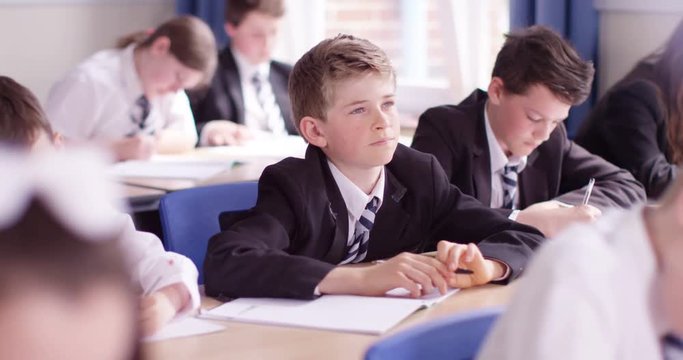 4k, A confused young student during a test in a school.