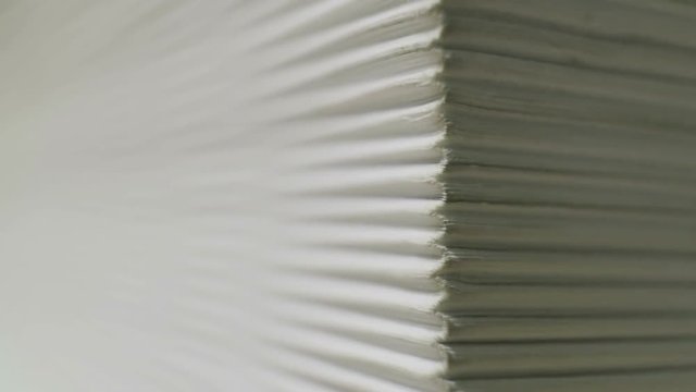 Swirls pages of a very thick Encyclopedia. Superincrease. Small depth of field