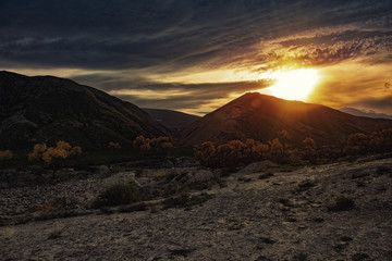 Sunrise in hilly mountains, mountain landscape