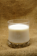milk in glass on sack