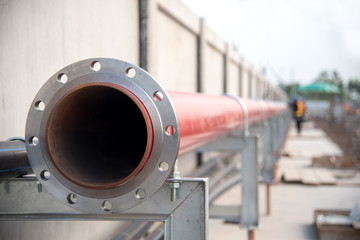 red fire pipe line extinguishing water in industrial building