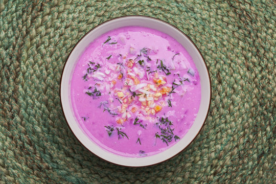 Traditional lithuanian cold beet pink soup, prepared of cucumber, beetrot, eggs and sour cream,  called saltibarsciai 
