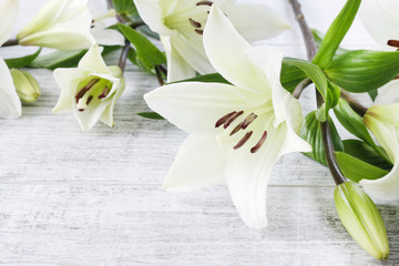 White lilies on wood