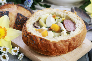 The sour rye soup inside loaf of bread