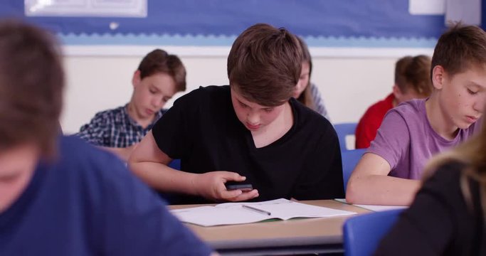 4k, A male student using the internet during an exam gets caught and gets his smartphone confiscated.