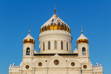 Golden dome of Cathedral of Christ the Saviour on the blue sky background. Moscow in winter