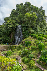 Fototapeta na wymiar Waterfall in the Ribeira dos Caldeiroes near Achada on the island of Sao Miguel, Portugal
