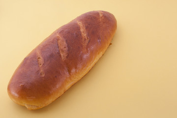 Home  baking, homemade bread on the yellow background