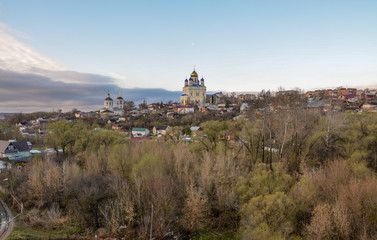 Voznesenskiy Sobor (Cathedral of the Ascension) dominating over small rural houses on the Yelchik river banks Yelets, Lipetsk region, Russia