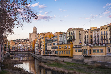 Fototapeta na wymiar Girona skyline cityscape with river houses reflected