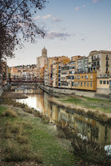 Romanic cathedral main landmark in Girona, Catalonia. Touristic city and main skyline with river houses and reflections