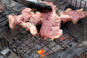 Grill Beef ferment salt on grill which has fire hot in stove style Thailand