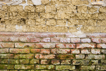 adobe and red brick wall