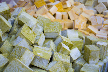 columns and rows of various colorful homemade bar soaps