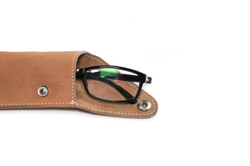 glasses in leather case on white background