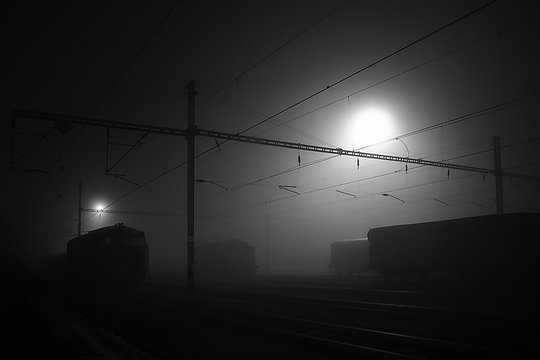 Black Night On A Freight Train Station In Chomutov City With Outlines Of Railway Objects And Trains