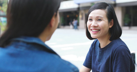 Girl friends talking to each other