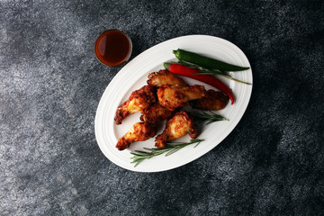 crispy barbecue chicken wings bbq on grey background
