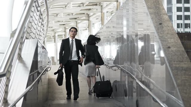 Businesspeople walking with haste crossed path in rush hour