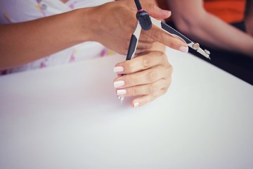 A woman uses a drawing tool