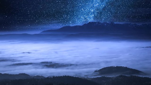 Stunning milky way and flowing clouds in the Tatra Mountains, Poland