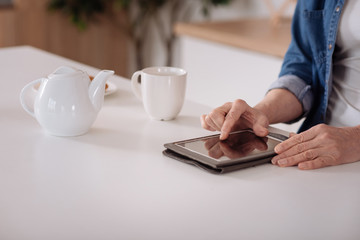 Close up of a senior woman using her tablet