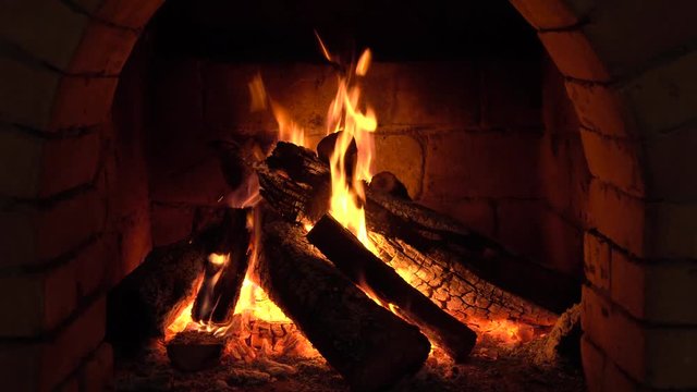 A fire burns in a fireplace, Fire to keep warm
