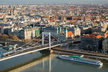 Budapest cityscape with Elisabeth Bridge, Inner-City Parish Church and boats of Danube river as seen from Gellert Hill in Budapest, Hungary